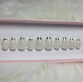spooky halloween chrome white 3d press-on nails by Polished by Maddie