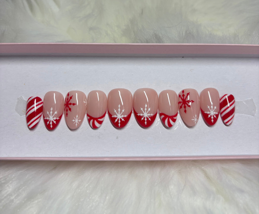 peppermint swirl christmas holiday snowflakes red white press-on nails by Polished by Maddie
