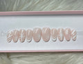 white nude neutral christmas ribbon bow snowflakes winter candy cane press-on nails by Polished by Maddie