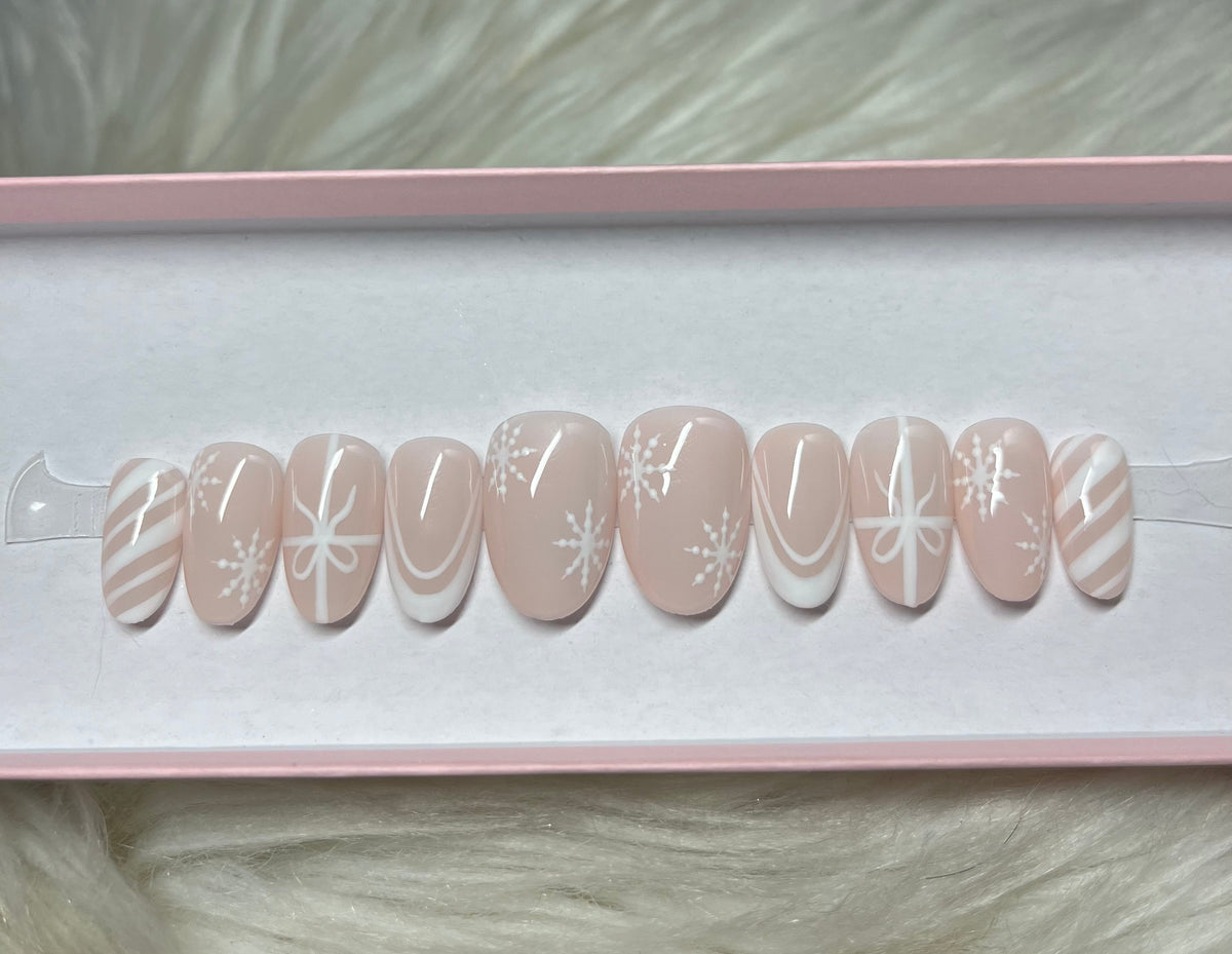 white nude neutral christmas ribbon bow snowflakes winter candy cane press-on nails by Polished by Maddie