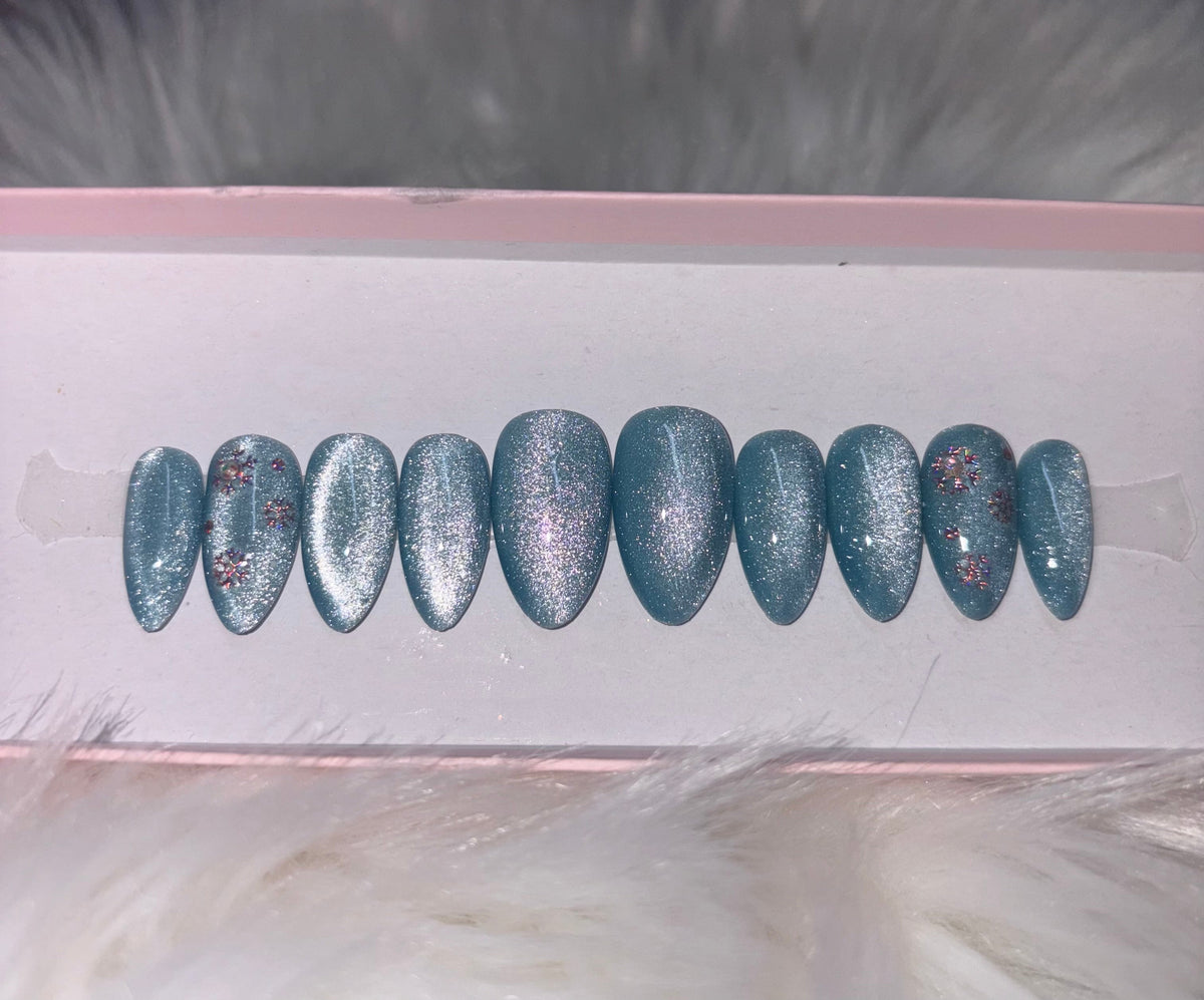 blue icy winter cat eye silver snowflakes christmas holidays press-on nails by Polished by Maddie