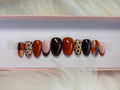 burnt red fall brown cheetah animal print checkers orange press-on nails by Polished by Maddie