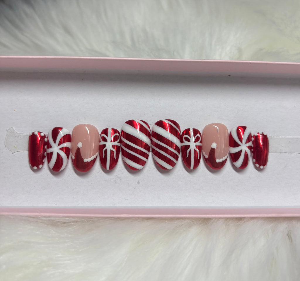 red chrome christmas candy cane ribbon gift bow santa hat peppermint holiday press-on nails by Polished by Maddie