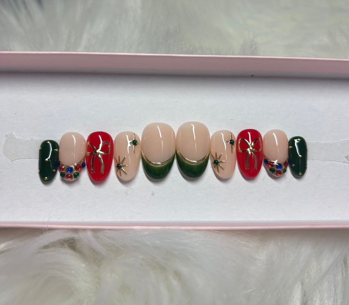 red gold gems christmas holiday bow green stars press-on nails by Polished by Maddie