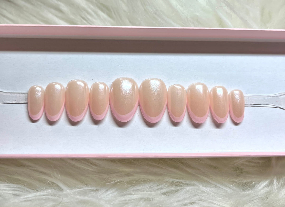 pink chrome hailey bieber glazed donut french tips whitney simmons press-on nails by Polished by Maddie